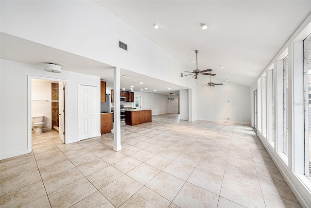 unfurnished living room with light tile patterned floors, ceiling fan, visible vents, and baseboards