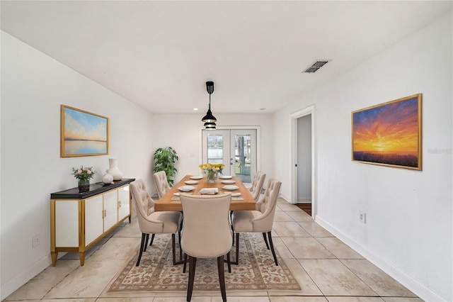 dining room featuring french doors, visible vents, baseboards, and light tile patterned floors