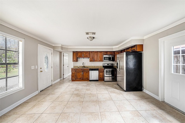 kitchen featuring stainless steel appliances, plenty of natural light, light countertops, and visible vents