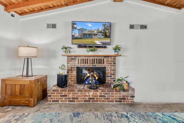 living room featuring vaulted ceiling with beams, a fireplace, and wood ceiling