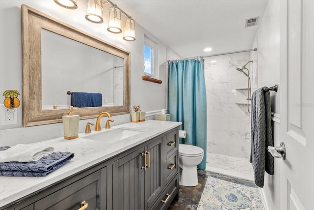 bathroom with vanity, a shower with curtain, and toilet