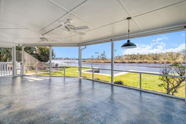 unfurnished sunroom featuring a water view and ceiling fan