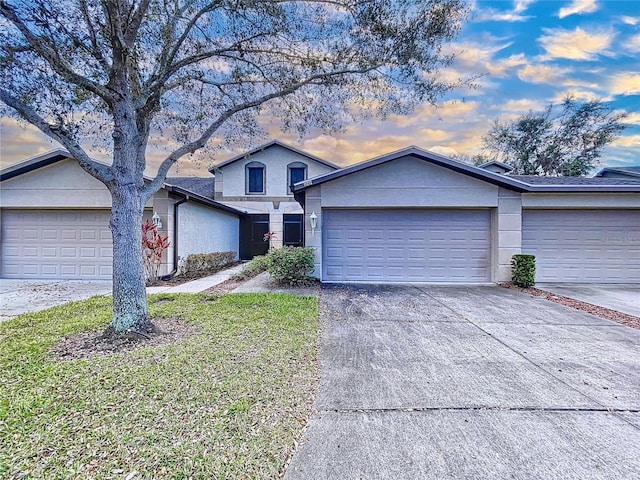 ranch-style house featuring a garage