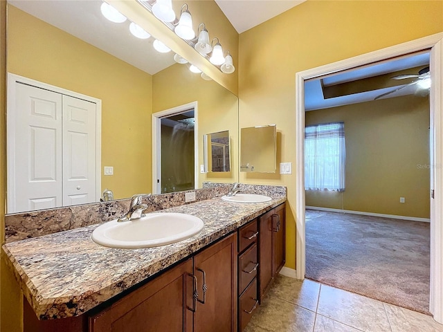 bathroom featuring tile patterned flooring, vanity, and ceiling fan