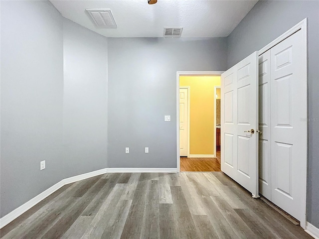 unfurnished bedroom with light hardwood / wood-style floors