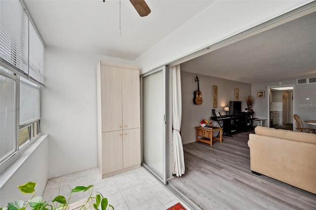 interior space featuring light hardwood / wood-style flooring and ceiling fan