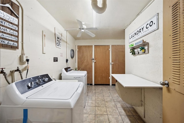 laundry room featuring light tile patterned flooring, washing machine and clothes dryer, and ceiling fan