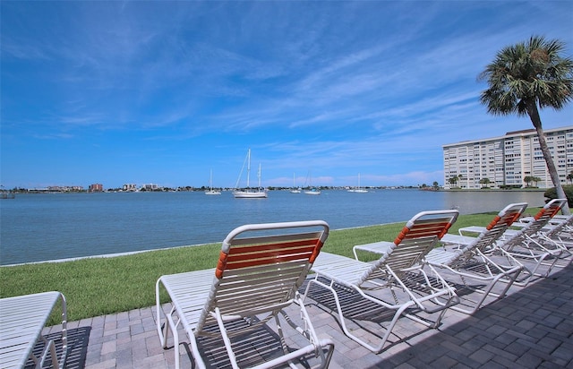 view of patio with a water view