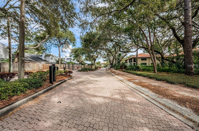 view of street featuring curbs, sidewalks, and a residential view