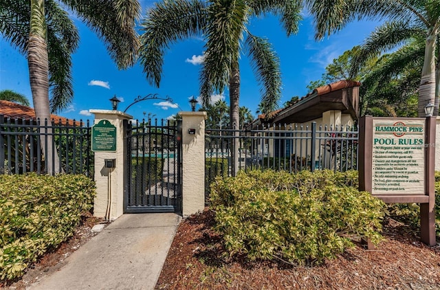 view of gate featuring fence