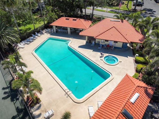 pool featuring a patio, a gazebo, fence, and a hot tub