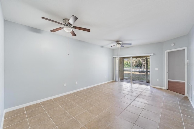 unfurnished room with light tile patterned flooring and ceiling fan