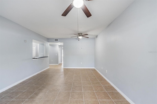 unfurnished living room with light tile patterned floors and ceiling fan