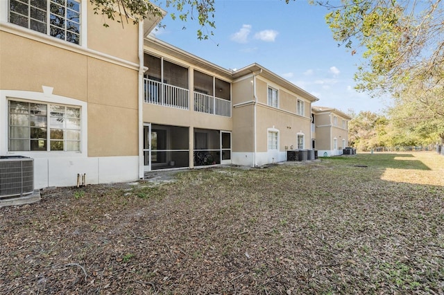 rear view of property featuring central air condition unit