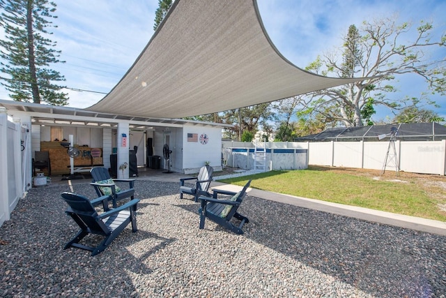 view of yard featuring a fenced in pool and a patio area