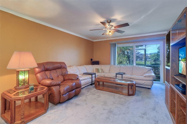 carpeted living room featuring crown molding and ceiling fan