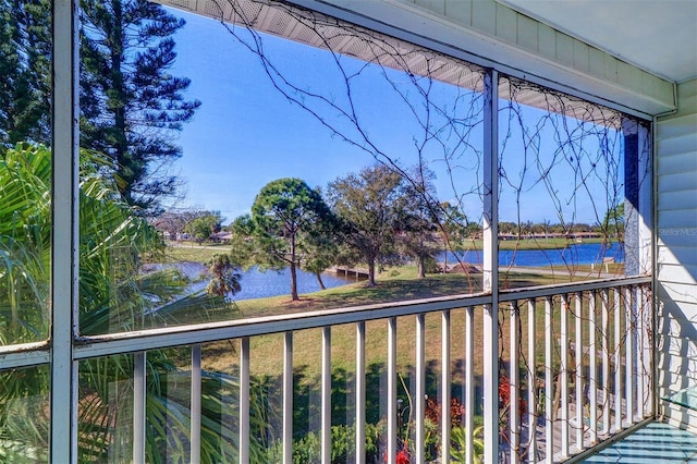 balcony featuring a water view