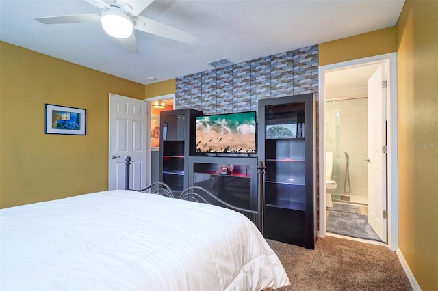 bedroom with ensuite bath, carpet floors, and ceiling fan