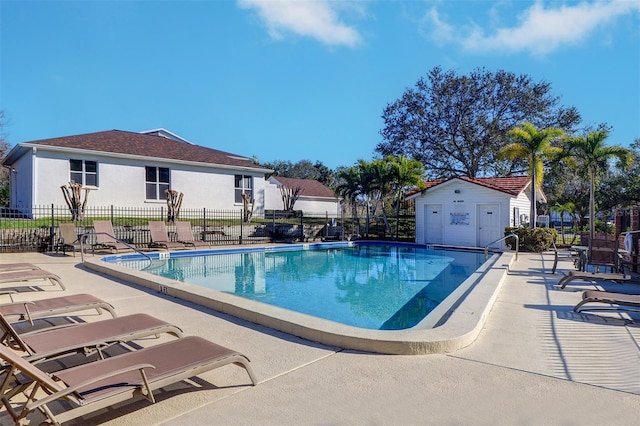 view of swimming pool with a patio