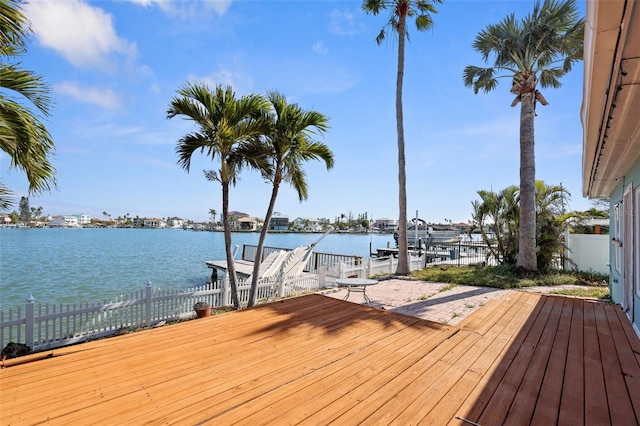 dock area featuring a water view and fence