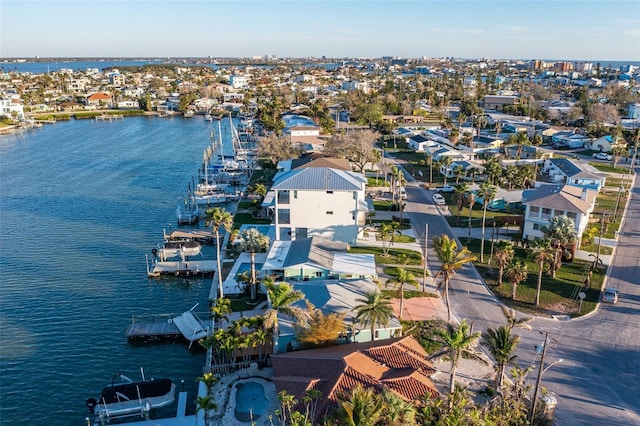 bird's eye view with a water view and a residential view