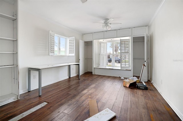 unfurnished bedroom with ornamental molding, dark wood-style flooring, multiple windows, and baseboards