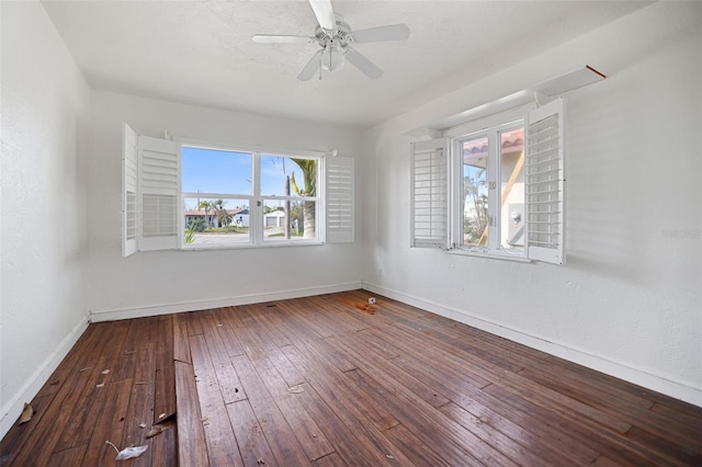 unfurnished room featuring ceiling fan, baseboards, hardwood / wood-style floors, and a textured wall