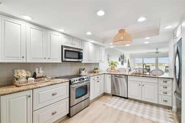 kitchen featuring white cabinetry, sink, and stainless steel appliances