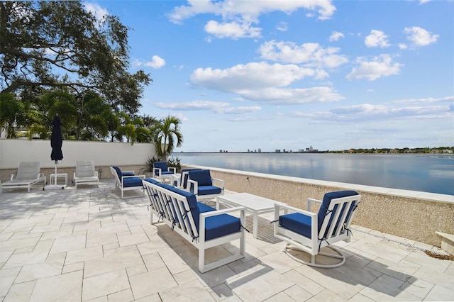 view of patio featuring an outdoor hangout area and a water view