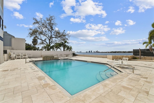 view of swimming pool featuring a patio area