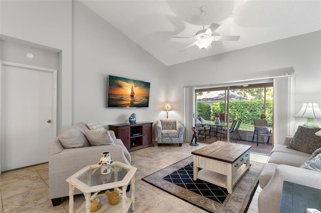 living room featuring ceiling fan and high vaulted ceiling