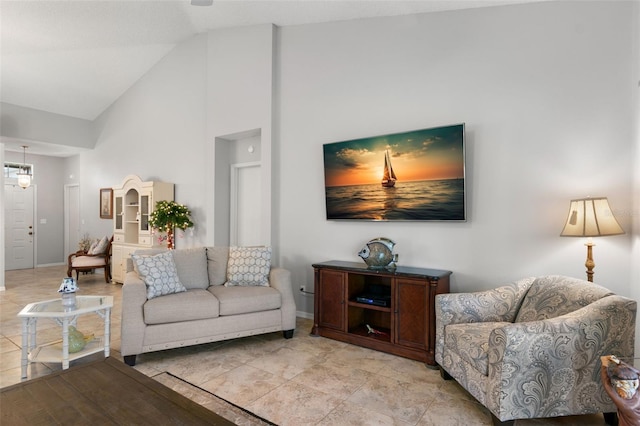 living room featuring high vaulted ceiling