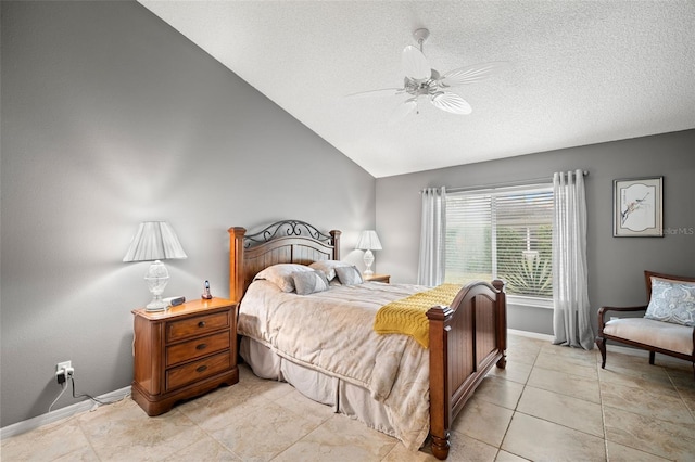 bedroom featuring ceiling fan, vaulted ceiling, a textured ceiling, and light tile patterned flooring