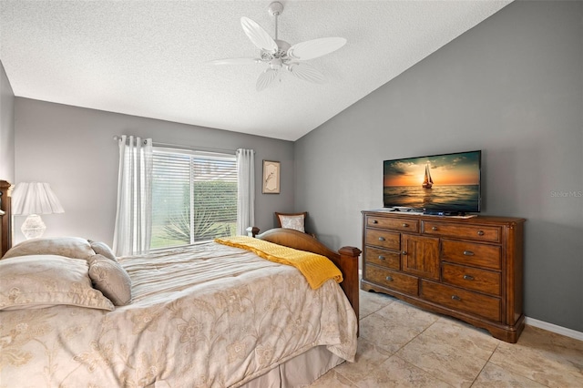 bedroom with ceiling fan, light tile patterned floors, vaulted ceiling, and a textured ceiling