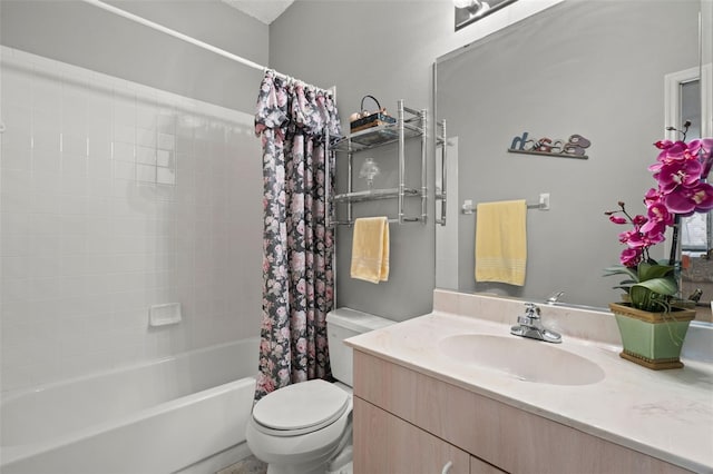 full bathroom featuring vanity, shower / bathtub combination with curtain, and toilet