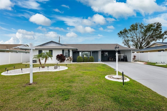 ranch-style house with a carport and a front yard