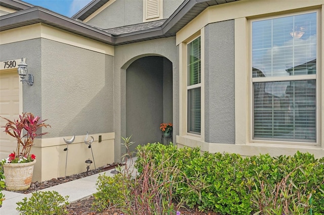 7580 Pool Compass Loop, Wesley Chapel, FL 33545 - entrance to property featuring stucco siding