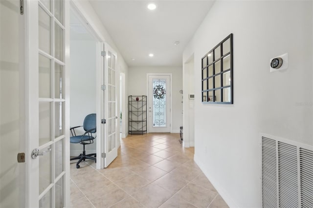 7580 Pool Compass Loop, Wesley Chapel, FL 33545 - hallway with french doors, visible vents, light tile patterned floors, baseboards, and recessed lighting