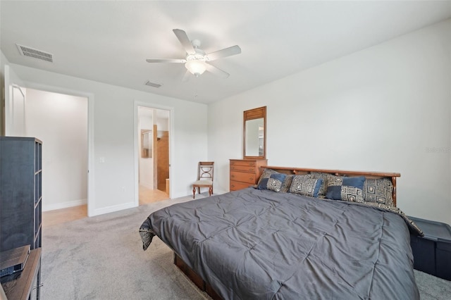 7580 Pool Compass Loop, Wesley Chapel, FL 33545 - carpeted bedroom featuring a ceiling fan, baseboards, visible vents, and ensuite bath