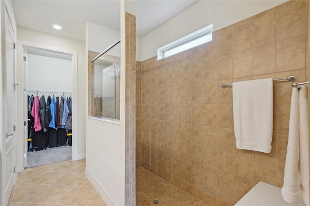 7580 Pool Compass Loop, Wesley Chapel, FL 33545 - bathroom with a walk in closet, tile patterned flooring, a walk in shower, baseboards, and recessed lighting