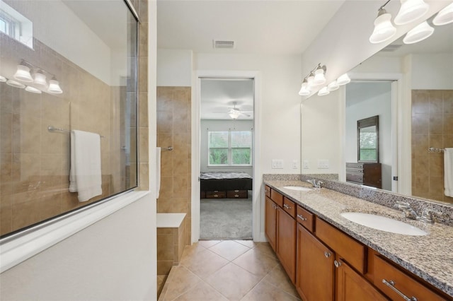 7580 Pool Compass Loop, Wesley Chapel, FL 33545 - ensuite bathroom with connected bathroom, visible vents, a sink, and tile patterned flooring
