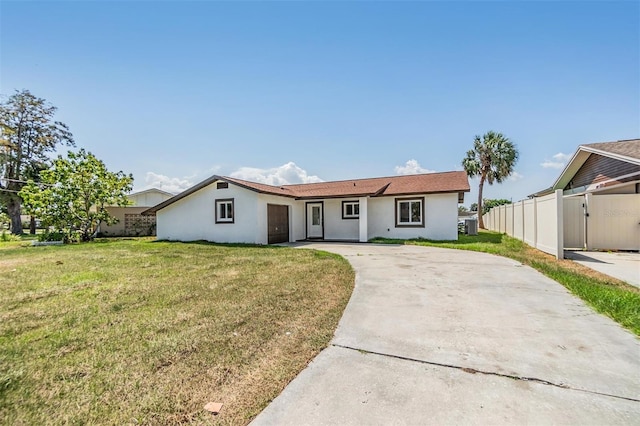 ranch-style house with a front lawn