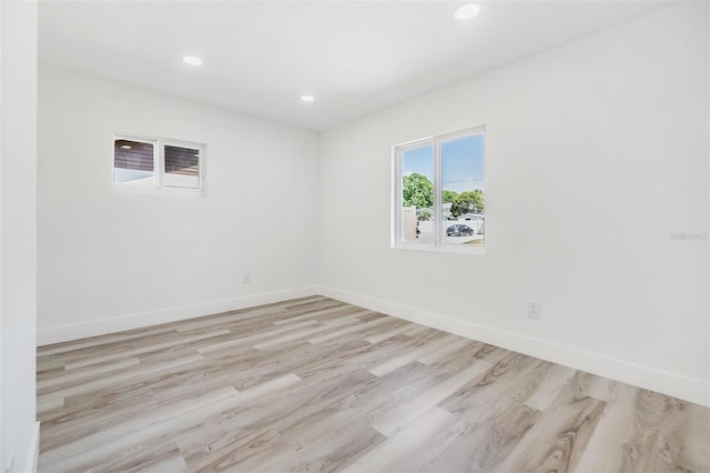 spare room featuring light hardwood / wood-style floors