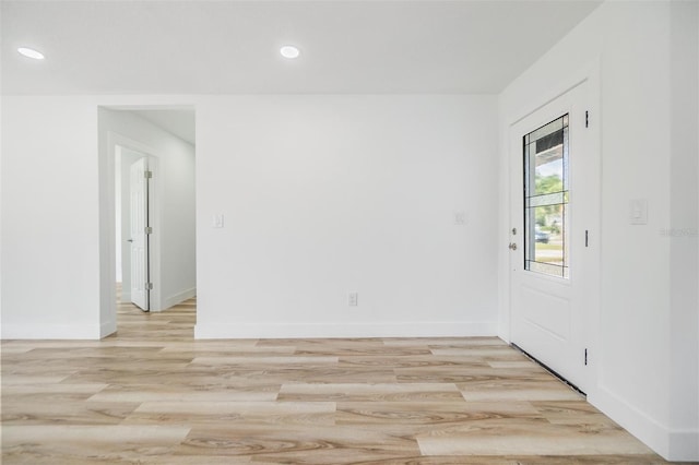 spare room featuring light hardwood / wood-style floors