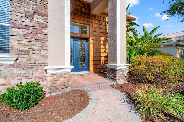 property entrance featuring french doors