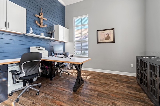 office space featuring dark hardwood / wood-style flooring and wood walls