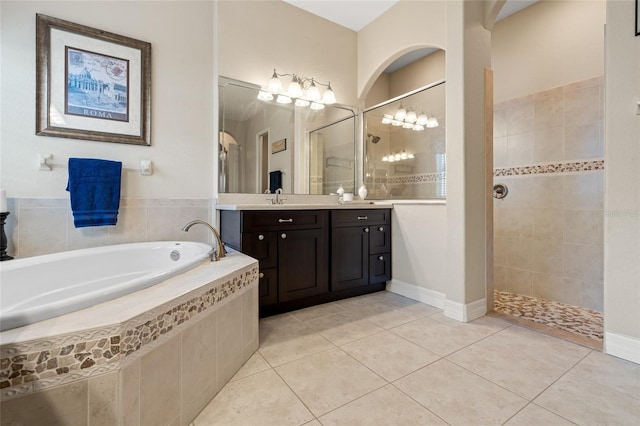 bathroom featuring independent shower and bath, vanity, and tile patterned floors