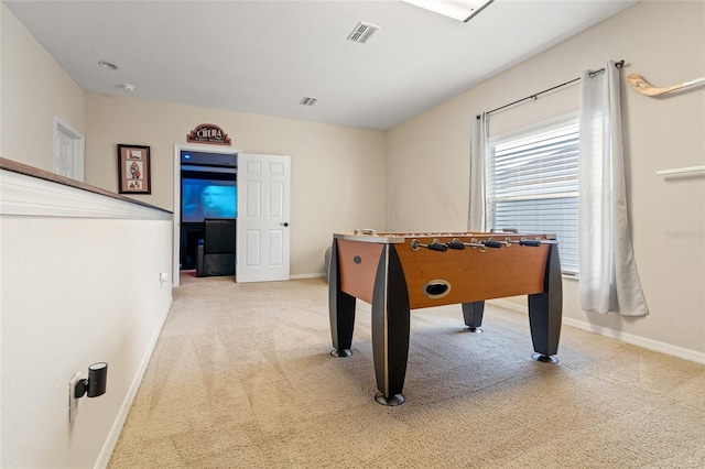 recreation room with carpet flooring