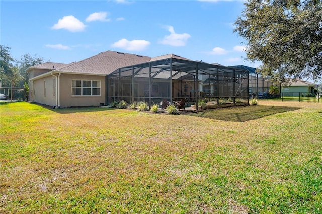 back of house featuring a yard