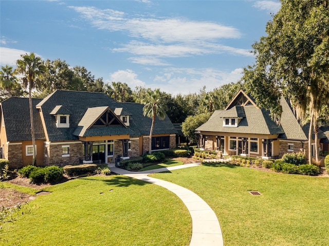 view of front facade featuring covered porch and a front lawn